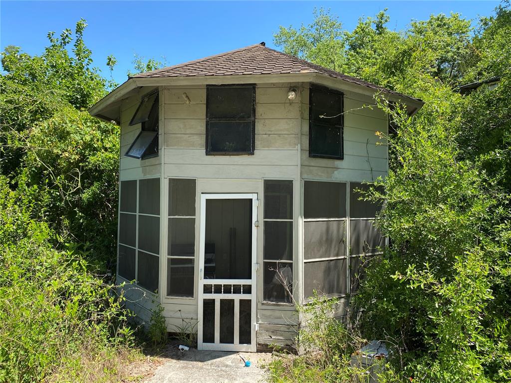 2424 Northeast 170th Street Citra, FL 32113 - Photo 11 of 53 a view of a wooden door and a yard