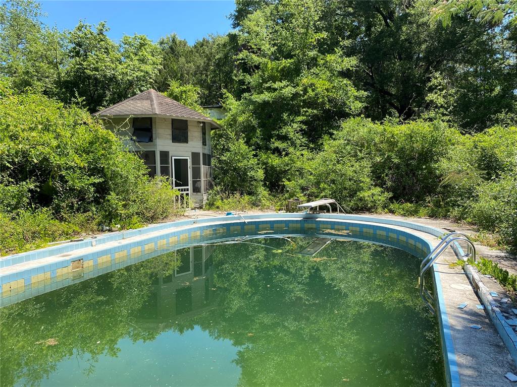 2424 Northeast 170th Street Citra, FL 32113 - Photo 12 of 53 a view of a house with a swimming pool