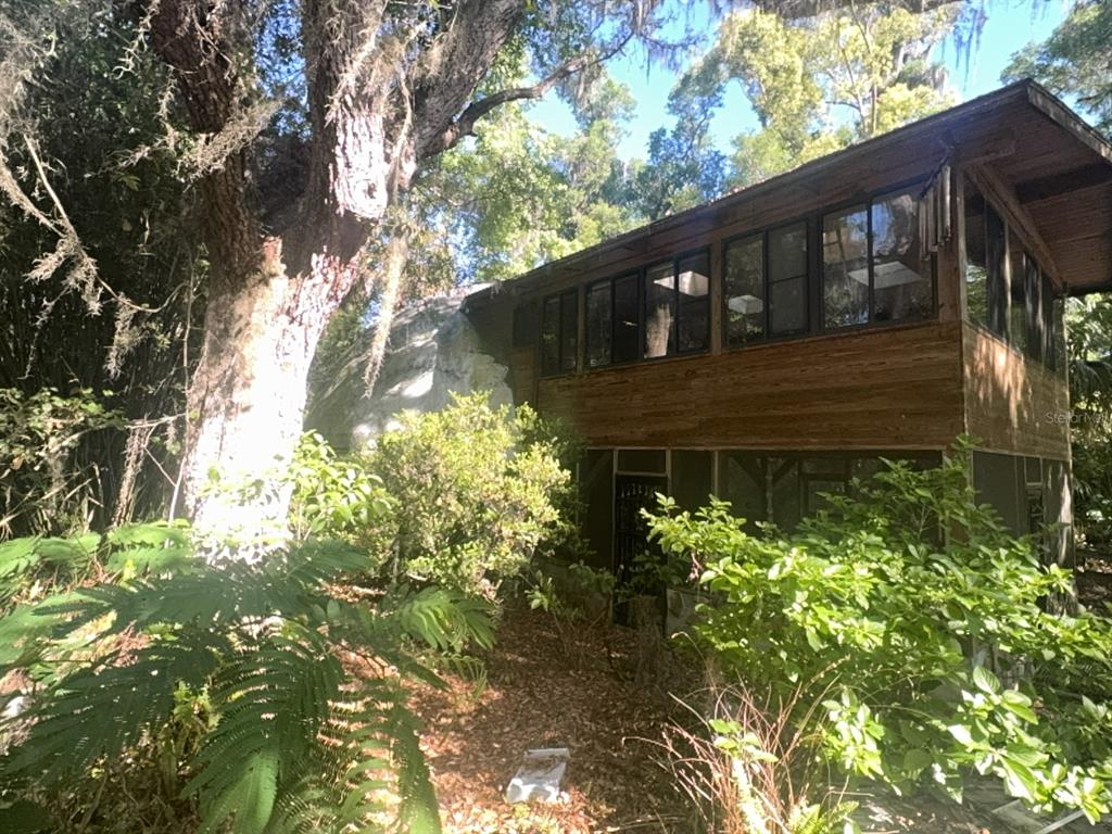 2424 Northeast 170th Street Citra, FL 32113 - Photo 24 of 53 a front view of a house with a yard