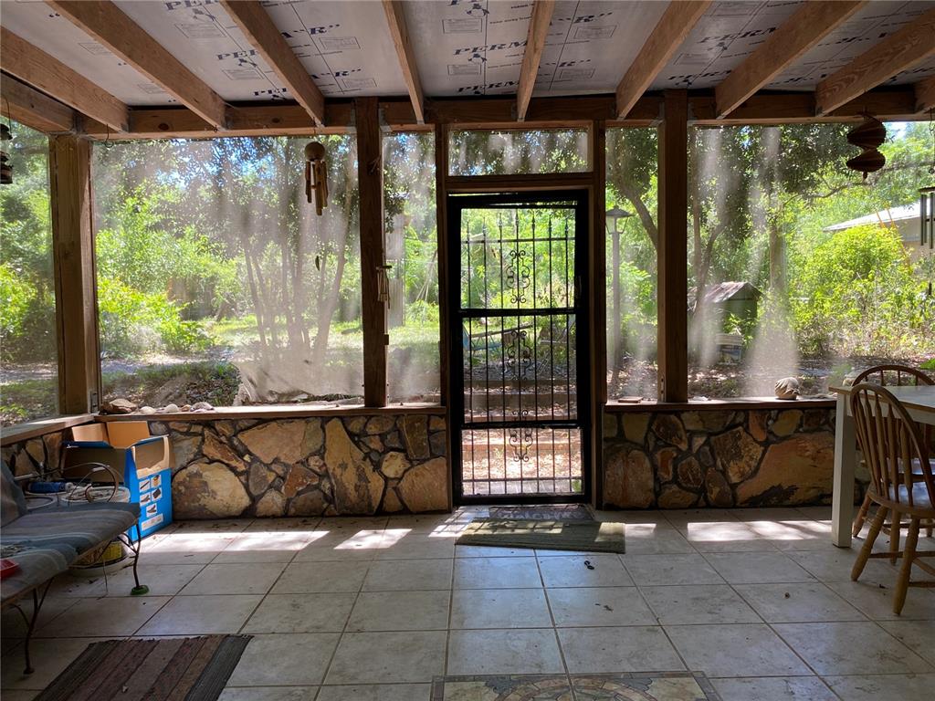 2424 Northeast 170th Street Citra, FL 32113 - Photo 3 of 53 a view of barbecue area with wooden floor