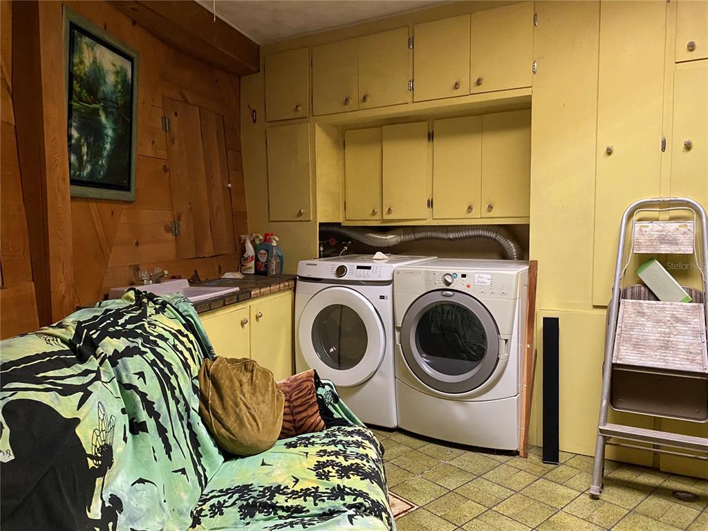 2424 Northeast 170th Street Citra, FL 32113 - Photo 35 of 53 a utility room with sink dryer and washer