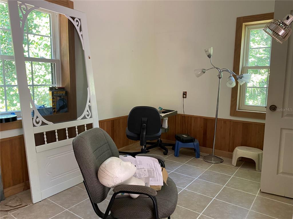 2424 Northeast 170th Street Citra, FL 32113 - Photo 41 of 53 a workspace with furniture and a window