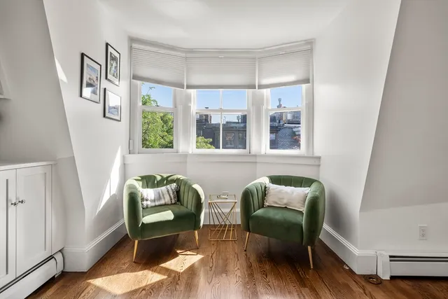 a view of a livingroom with furniture and windows