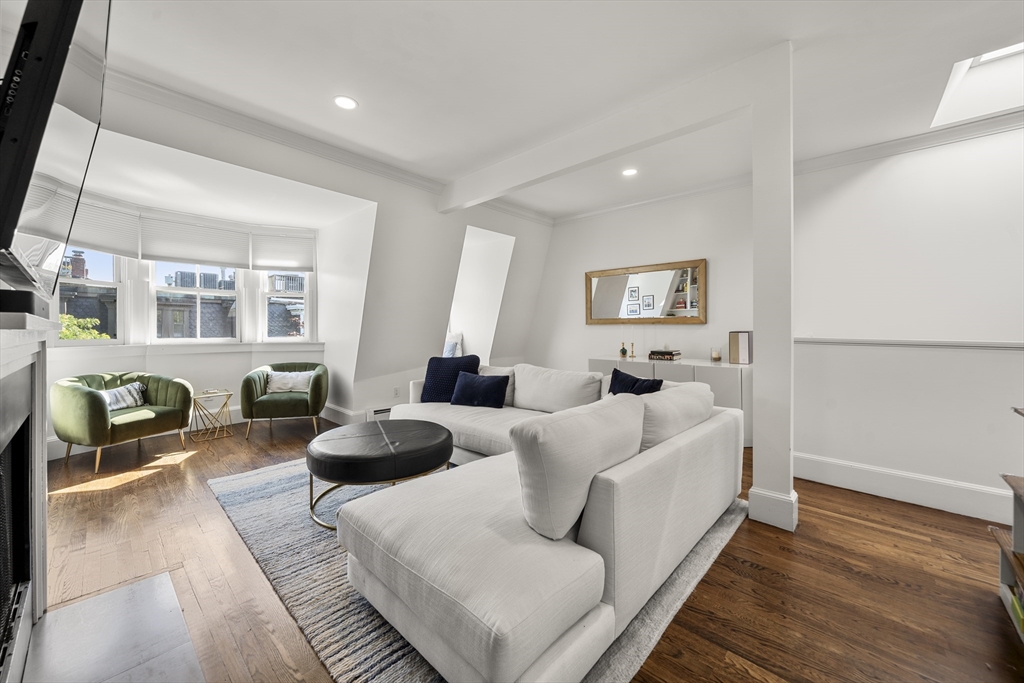 36 Upton Street, Unit 3 Boston, MA 02118 - Photo 15 of 33 a living room with furniture and a large window