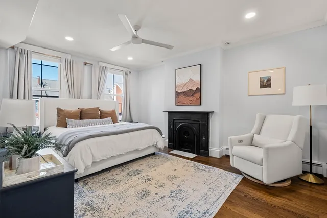 a bedroom with a large bed and a couch