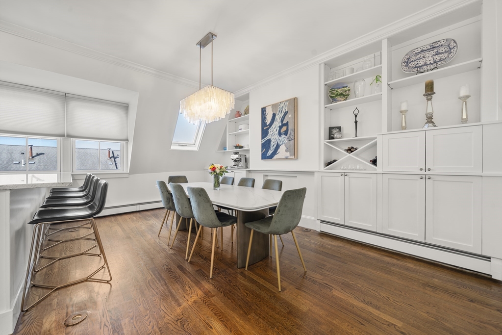 36 Upton Street, Unit 3 Boston, MA 02118 - Photo 2 of 33 a view of a dining room with furniture and wooden floor
