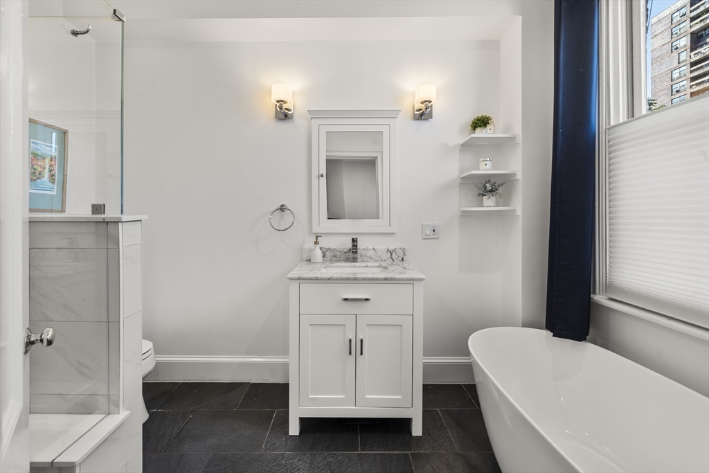 36 Upton Street, Unit 3 Boston, MA 02118 - Photo 21 of 33 a bathroom with a sink a toilet and tub