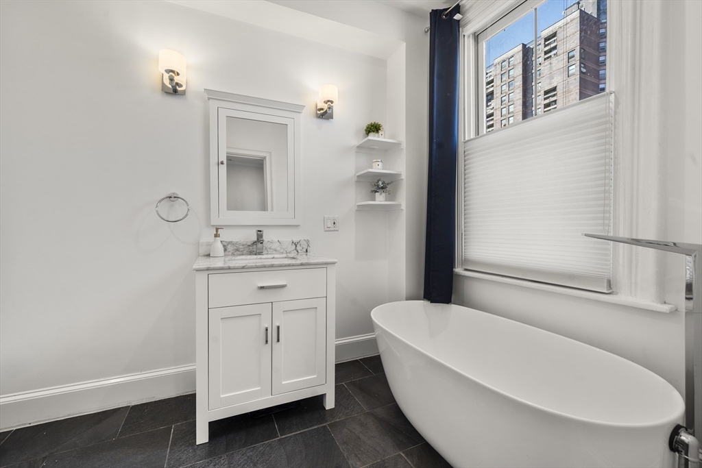 36 Upton Street, Unit 3 Boston, MA 02118 - Photo 22 of 33 a bathroom with a sink a toilet and shower