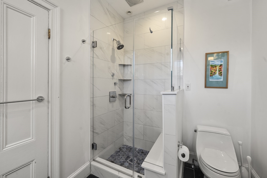 36 Upton Street, Unit 3 Boston, MA 02118 - Photo 23 of 33 a bathroom with a toilet and a shower