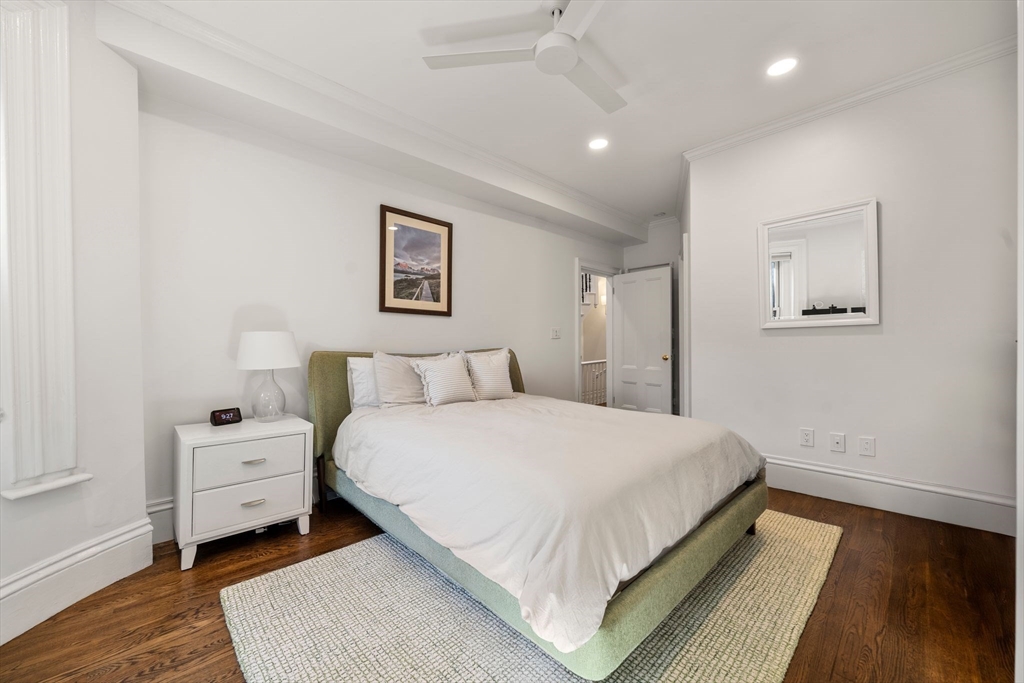 36 Upton Street, Unit 3 Boston, MA 02118 - Photo 24 of 33 a bedroom with a bed and a painting on the wall