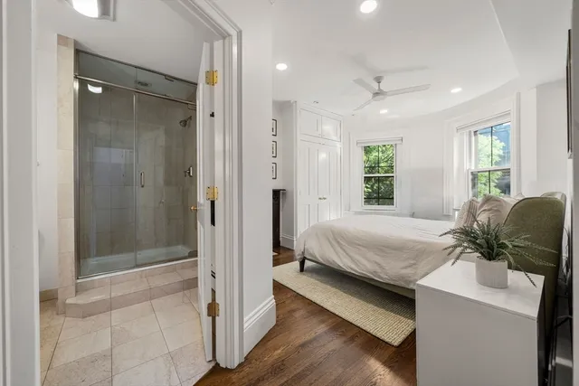 a room with a bed and a mirror