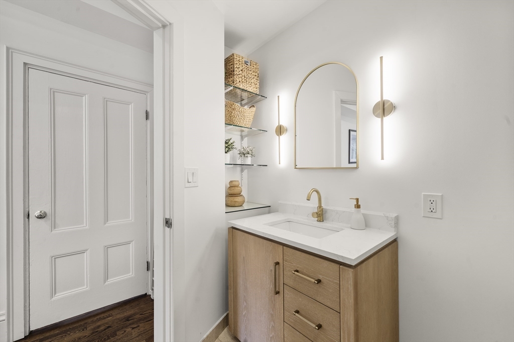 36 Upton Street, Unit 3 Boston, MA 02118 - Photo 27 of 33 a bathroom with a double vanity sink and a mirror