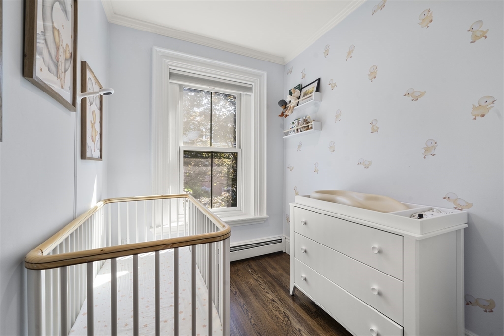 36 Upton Street, Unit 3 Boston, MA 02118 - Photo 28 of 33 a view of hallway with window and wooden floor