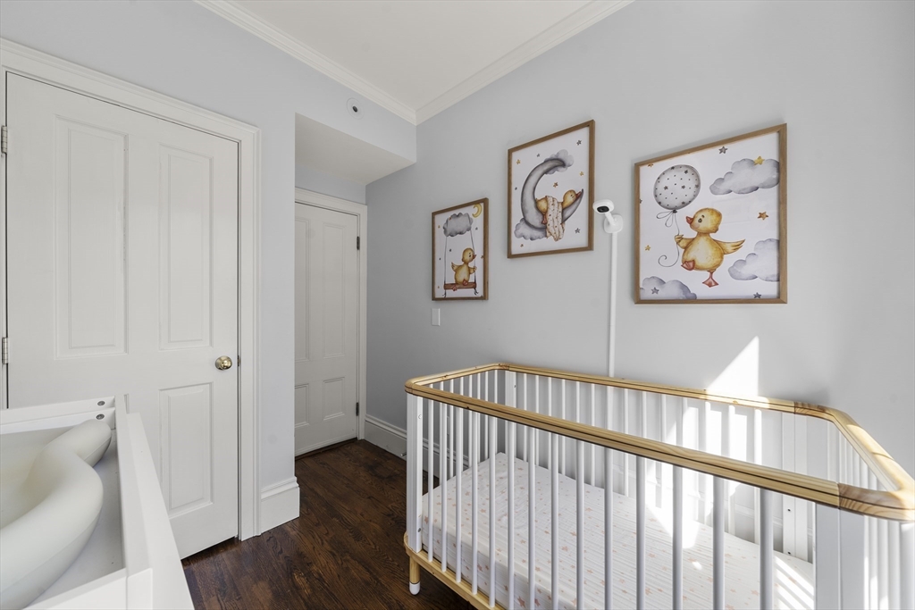 36 Upton Street, Unit 3 Boston, MA 02118 - Photo 29 of 33 a view of a hallway with wooden floor and a bathroom