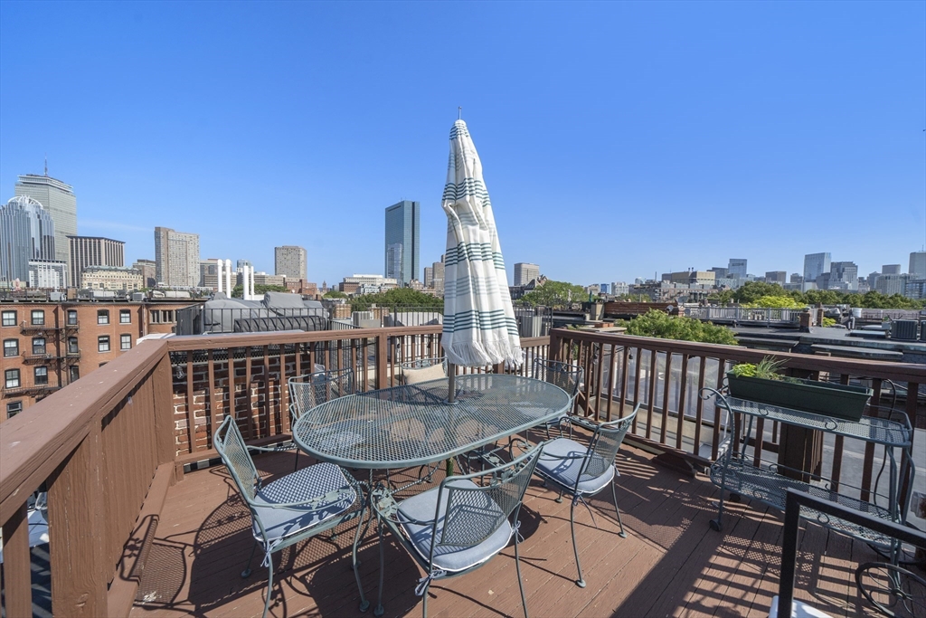 36 Upton Street, Unit 3 Boston, MA 02118 - Photo 31 of 33 a view of a balcony with wooden benches