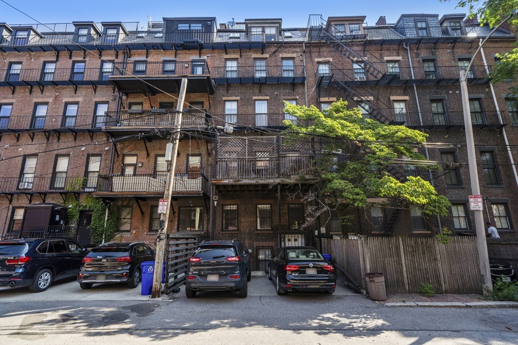36 Upton Street, Unit 3 Boston, MA 02118 - Photo 32 of 33 a car parked in front of a building