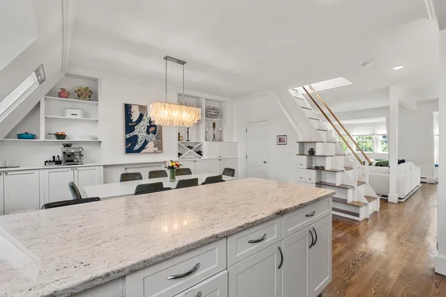 a view of living room with wooden floor and staircase