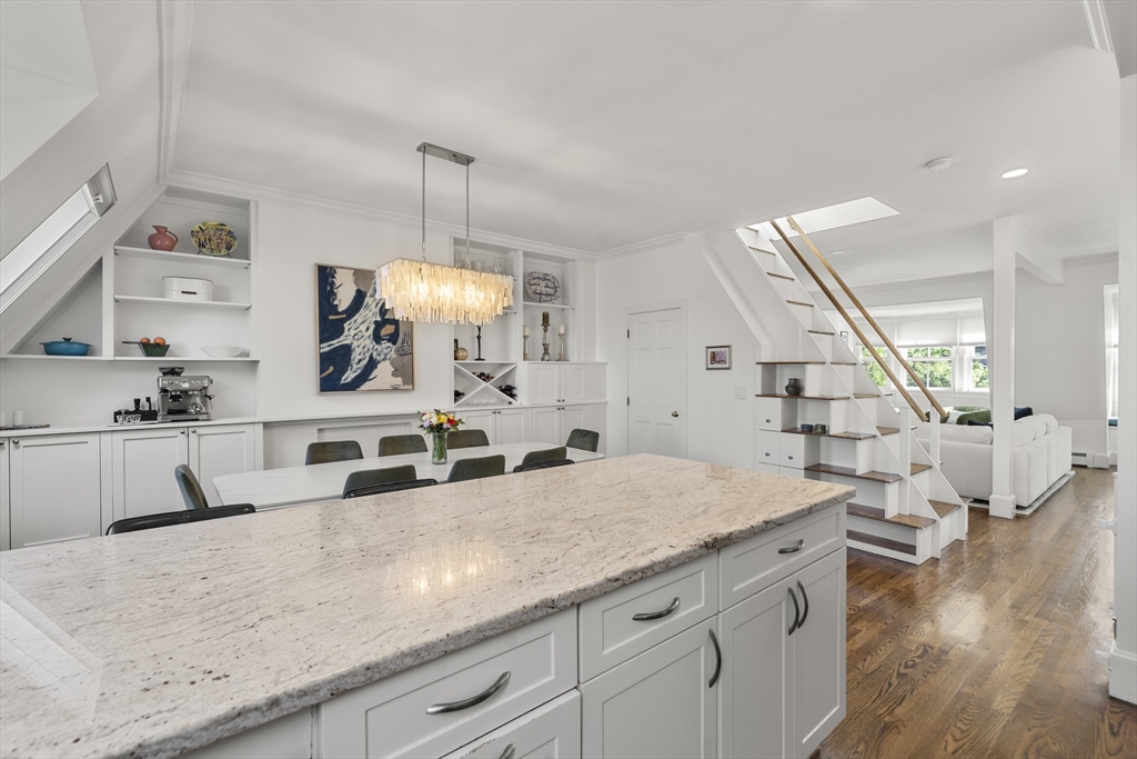 36 Upton Street, Unit 3 Boston, MA 02118 - Photo 7 of 33 a view of living room with wooden floor and staircase