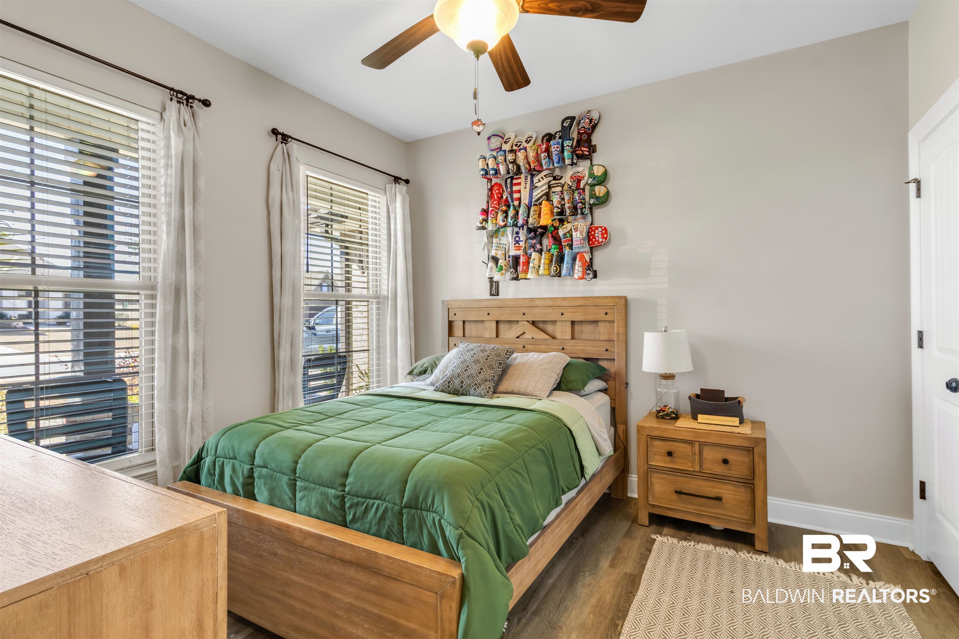 22531 Putter Lane Foley, AL 36535 - Photo 26 of 43 Bedroom featuring wood finished floors and a ceiling fan