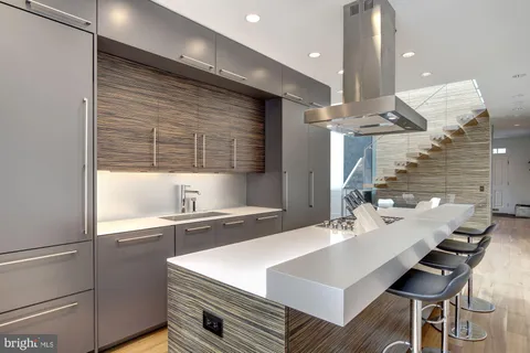 a kitchen with a sink cabinets and window