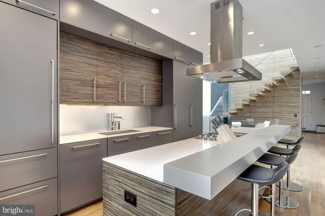 a kitchen with a sink cabinets and window