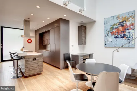 a kitchen with a stove and a refrigerator