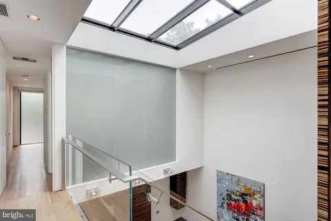 a bedroom with a bed and a lamp