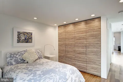 a bedroom with a bed and a cabinets