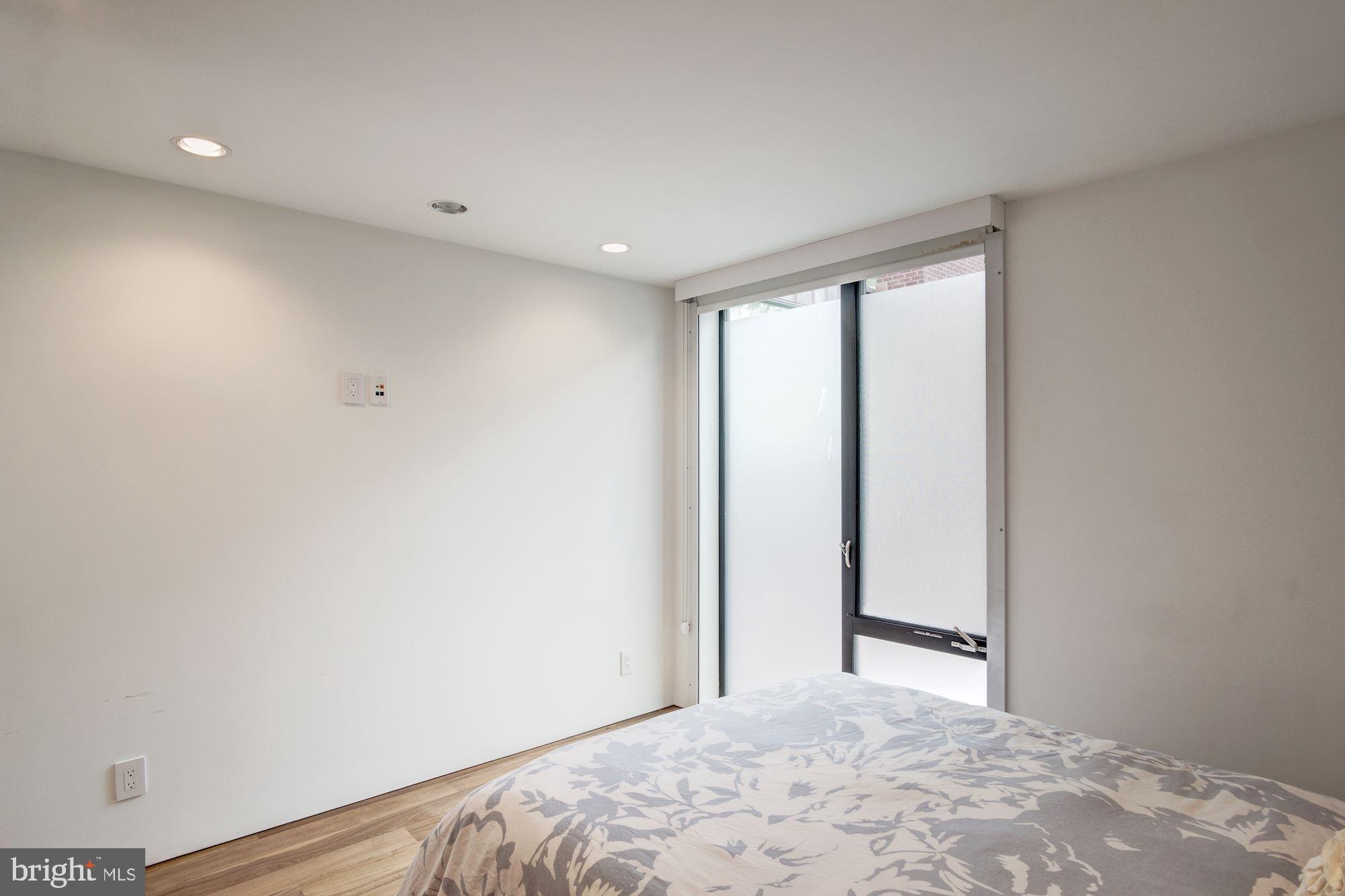 3329 Q Street Northwest Washington, DC 20007 - Photo 28 of 37 a view of a big room with wooden floor and windows