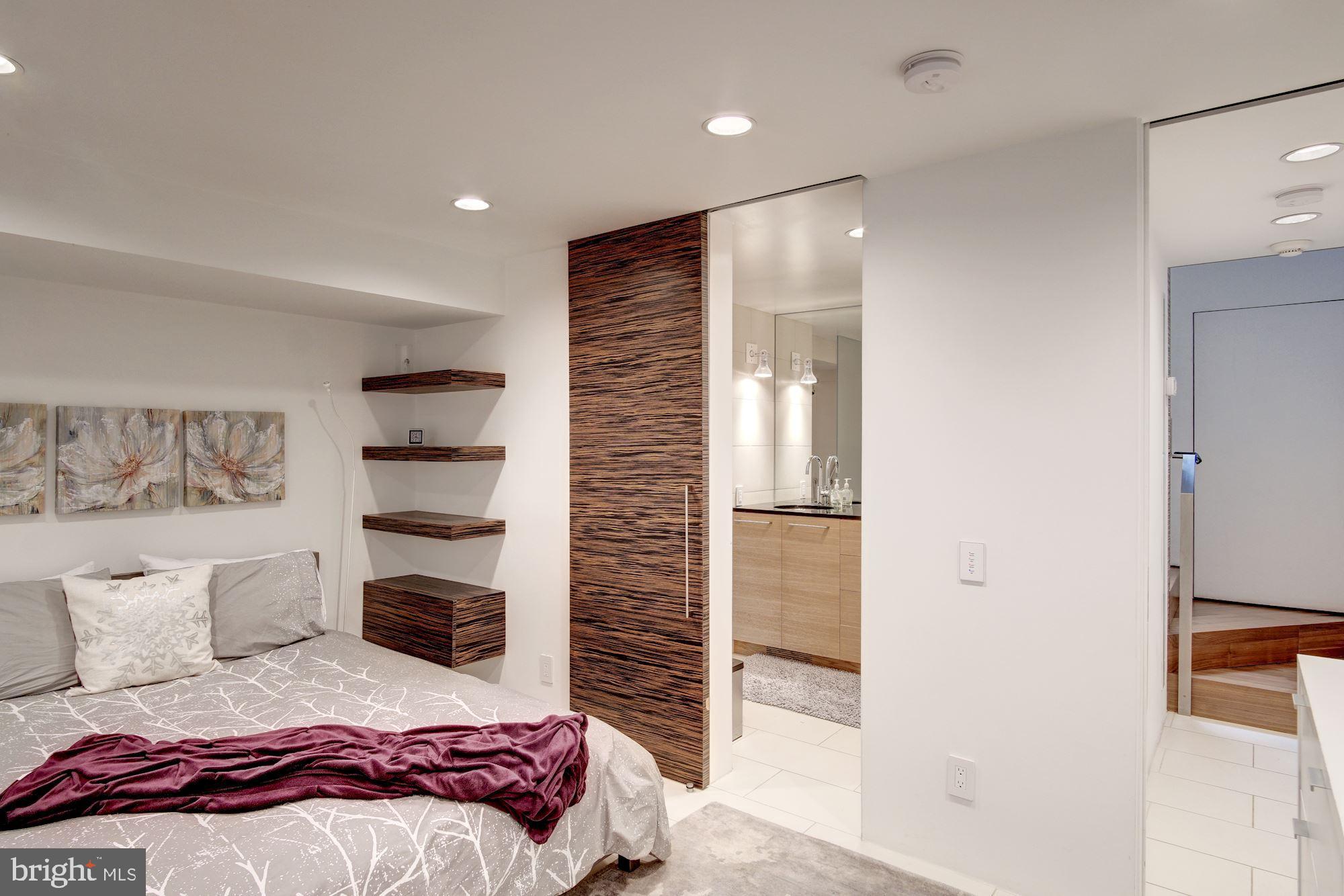 3329 Q Street Northwest Washington, DC 20007 - Photo 30 of 37 a bedroom with a bed and a cabinets