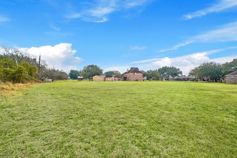 0 Rabb Ridge Drive Richmond, TX 77469 - Photo 11 of 11 a view of yard with swimming pool and green space