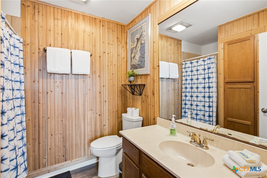 520 15th Street Port O'Connor, TX 77982 - Photo 11 of 36 a bathroom with a sink toilet and shower