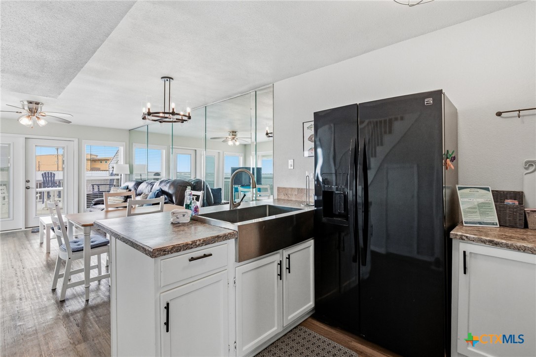 520 15th Street Port O'Connor, TX 77982 - Photo 14 of 36 a kitchen with stainless steel appliances granite countertop a sink stove and refrigerator