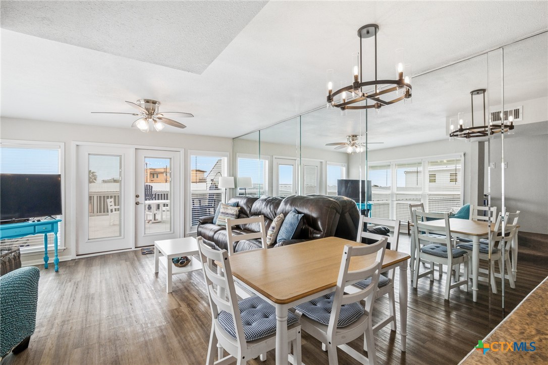 520 15th Street Port O'Connor, TX 77982 - Photo 18 of 36 a view of a dining room with furniture wooden floor and chandelier