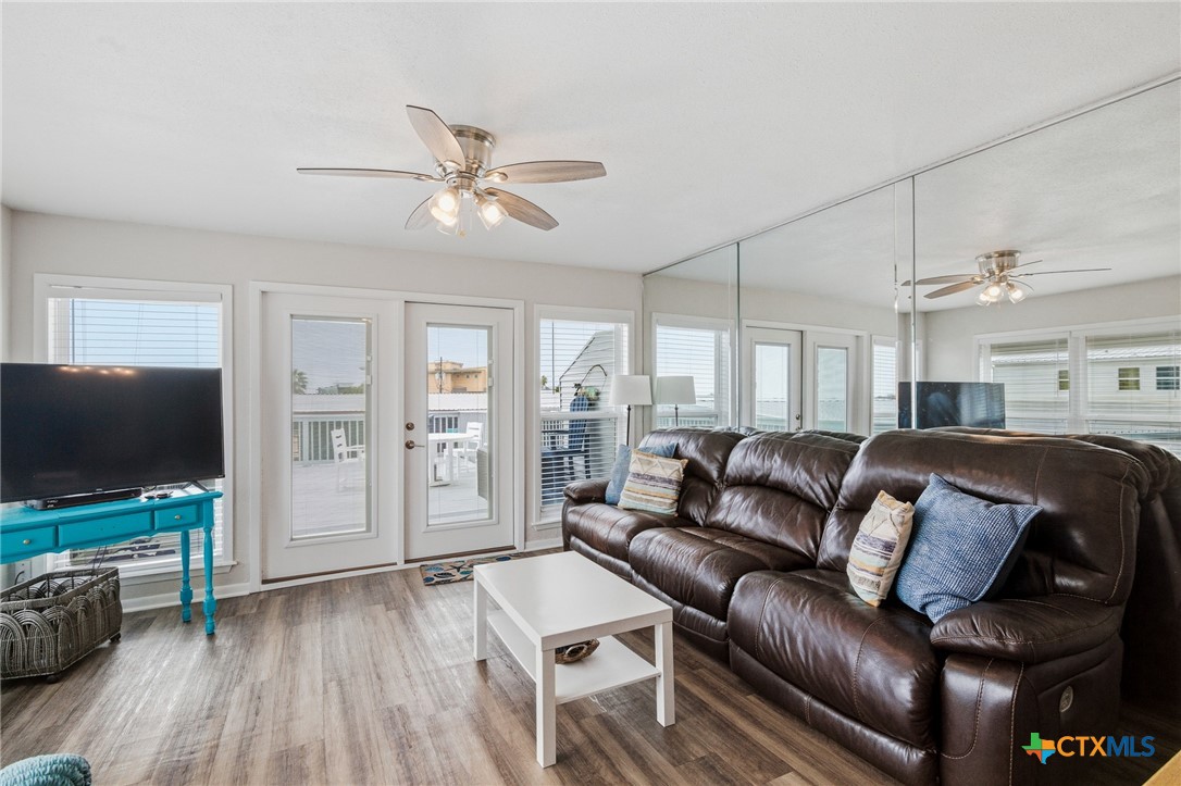 520 15th Street Port O'Connor, TX 77982 - Photo 19 of 36 a living room with furniture and a flat screen tv