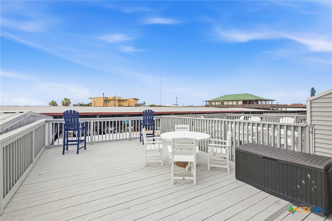 520 15th Street Port O'Connor, TX 77982 - Photo 21 of 36 a balcony with furniture and wooden floor