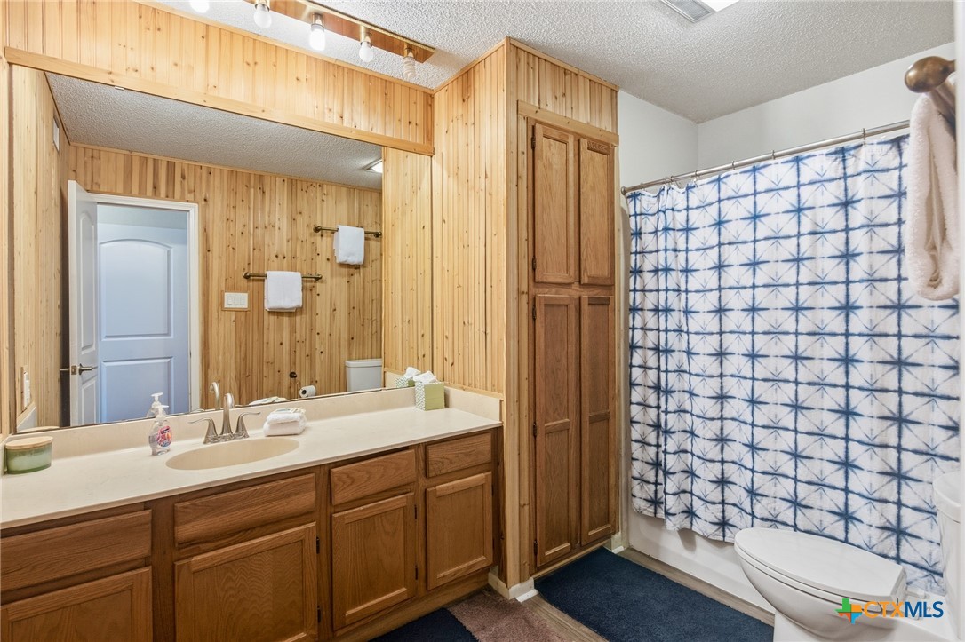 520 15th Street Port O'Connor, TX 77982 - Photo 24 of 36 a bathroom with a double vanity sink mirror and shower