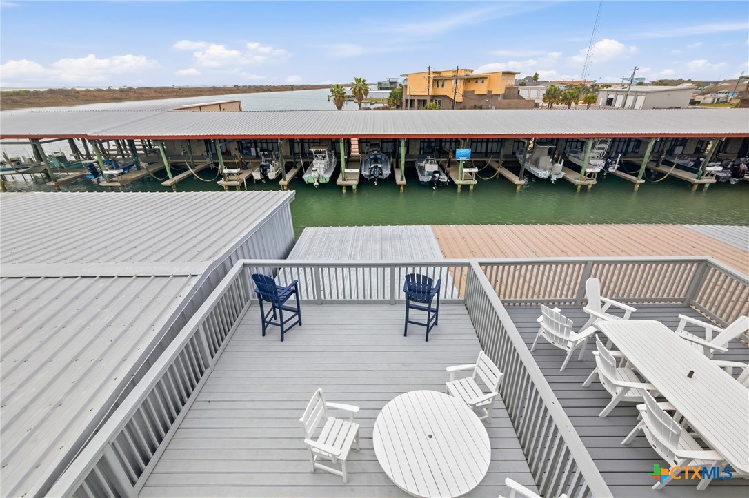 520 15th Street Port O'Connor, TX 77982 - Photo 27 of 36 a balcony with table and chairs