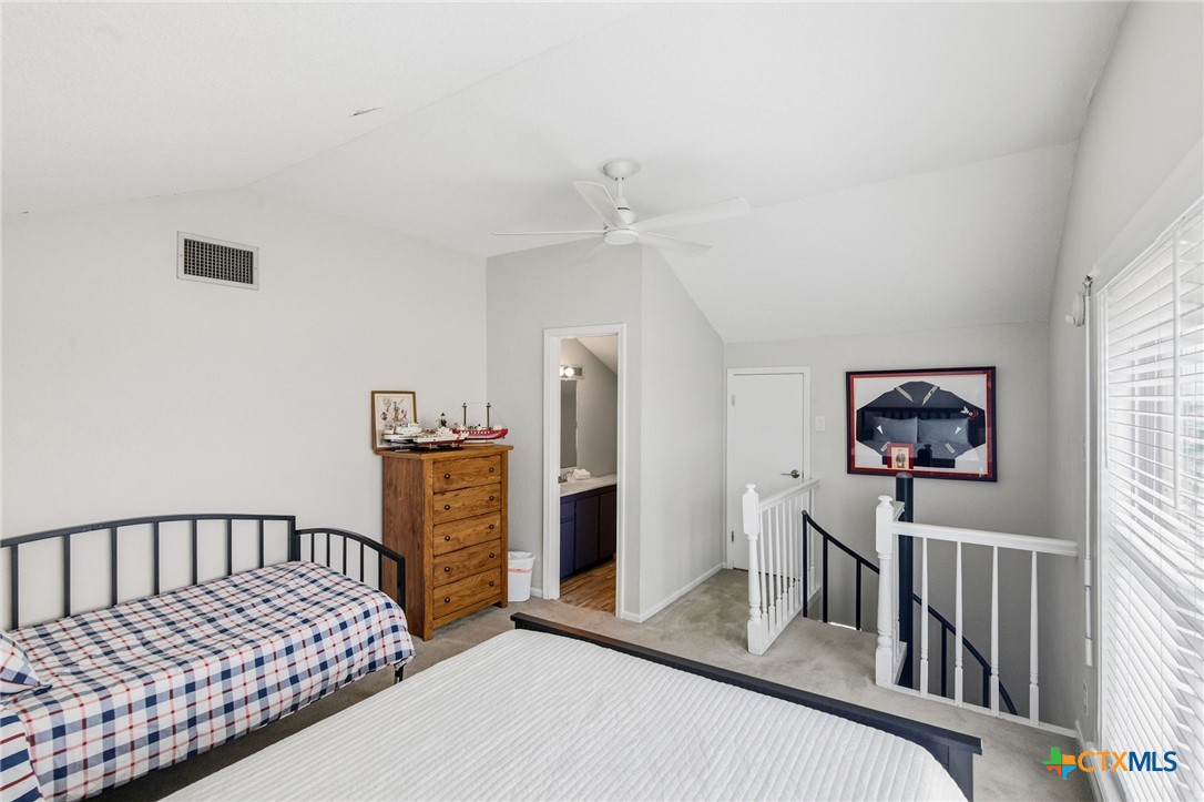 520 15th Street Port O'Connor, TX 77982 - Photo 34 of 36 a bedroom with furniture and a window
