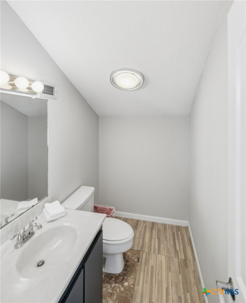 520 15th Street Port O'Connor, TX 77982 - Photo 35 of 36 a bathroom with a sink vanity and toilet