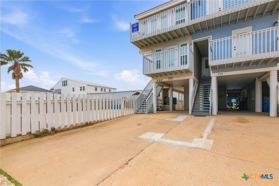 520 15th Street Port O'Connor, TX 77982 - Photo 4 of 36 a front view of a building with garage