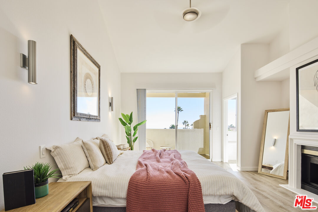 6465 Zuma View Place, Unit 163 Malibu, CA 90265 - Photo 12 of 26 a bedroom with a bed and a flat screen tv