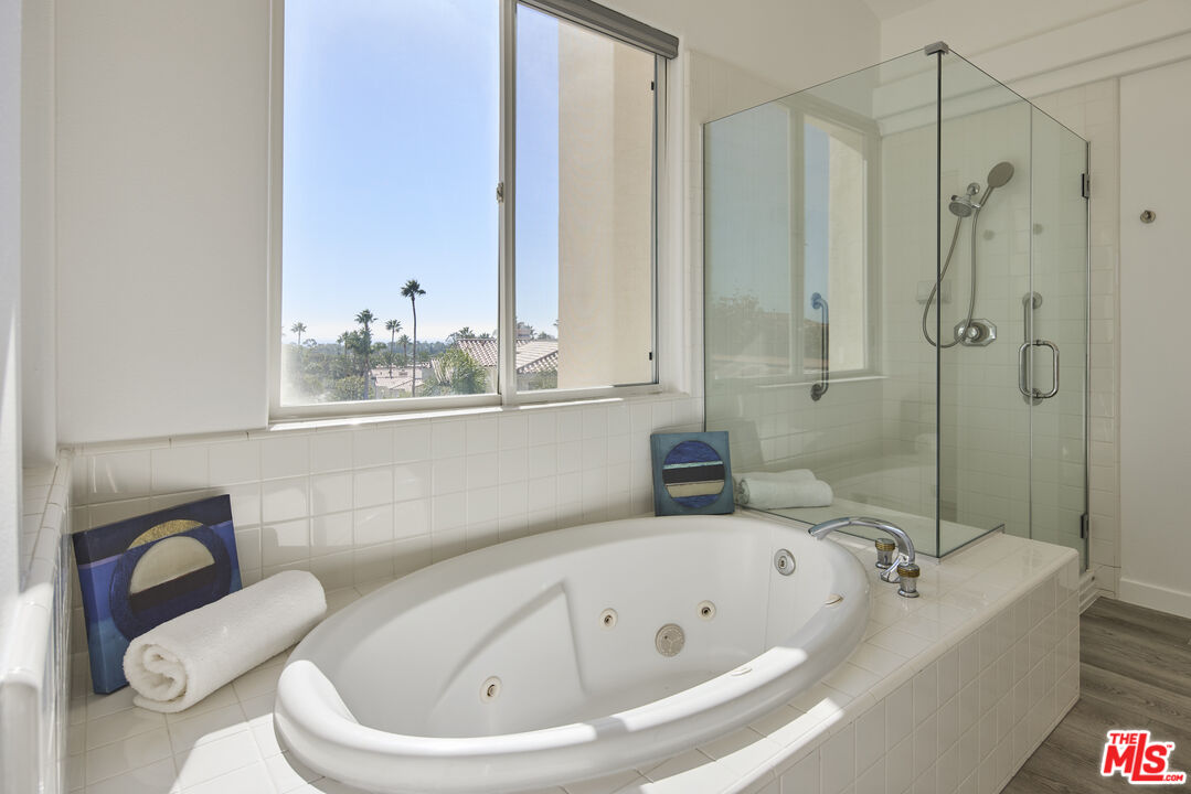 6465 Zuma View Place, Unit 163 Malibu, CA 90265 - Photo 17 of 26 a bathroom with a bathtub and shower