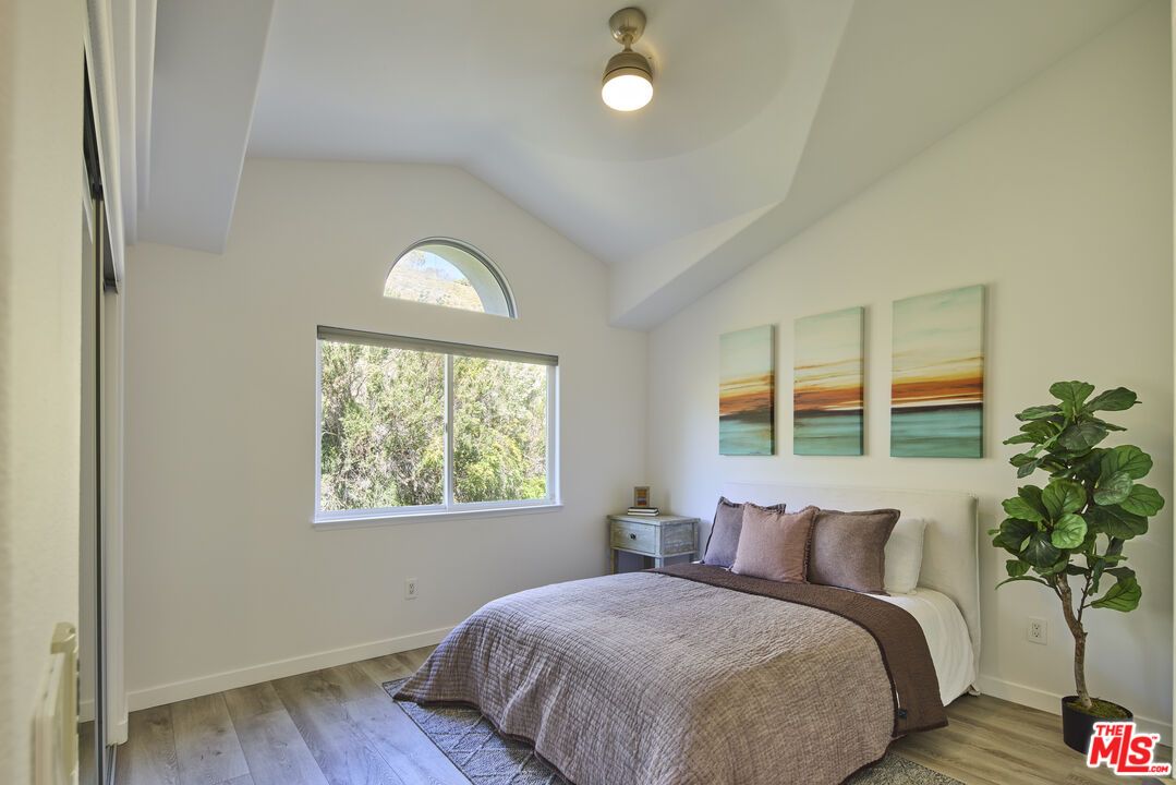 6465 Zuma View Place, Unit 163 Malibu, CA 90265 - Photo 18 of 26 a bedroom with bed and a window