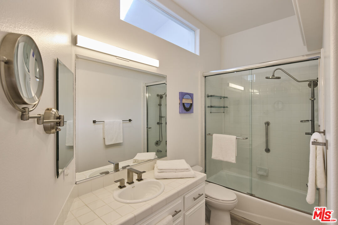 6465 Zuma View Place, Unit 163 Malibu, CA 90265 - Photo 19 of 26 a bathroom with a sink toilet and shower