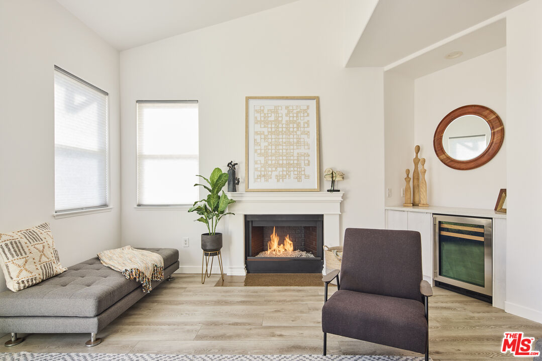 6465 Zuma View Place, Unit 163 Malibu, CA 90265 - Photo 5 of 26 a living room with furniture and a fireplace