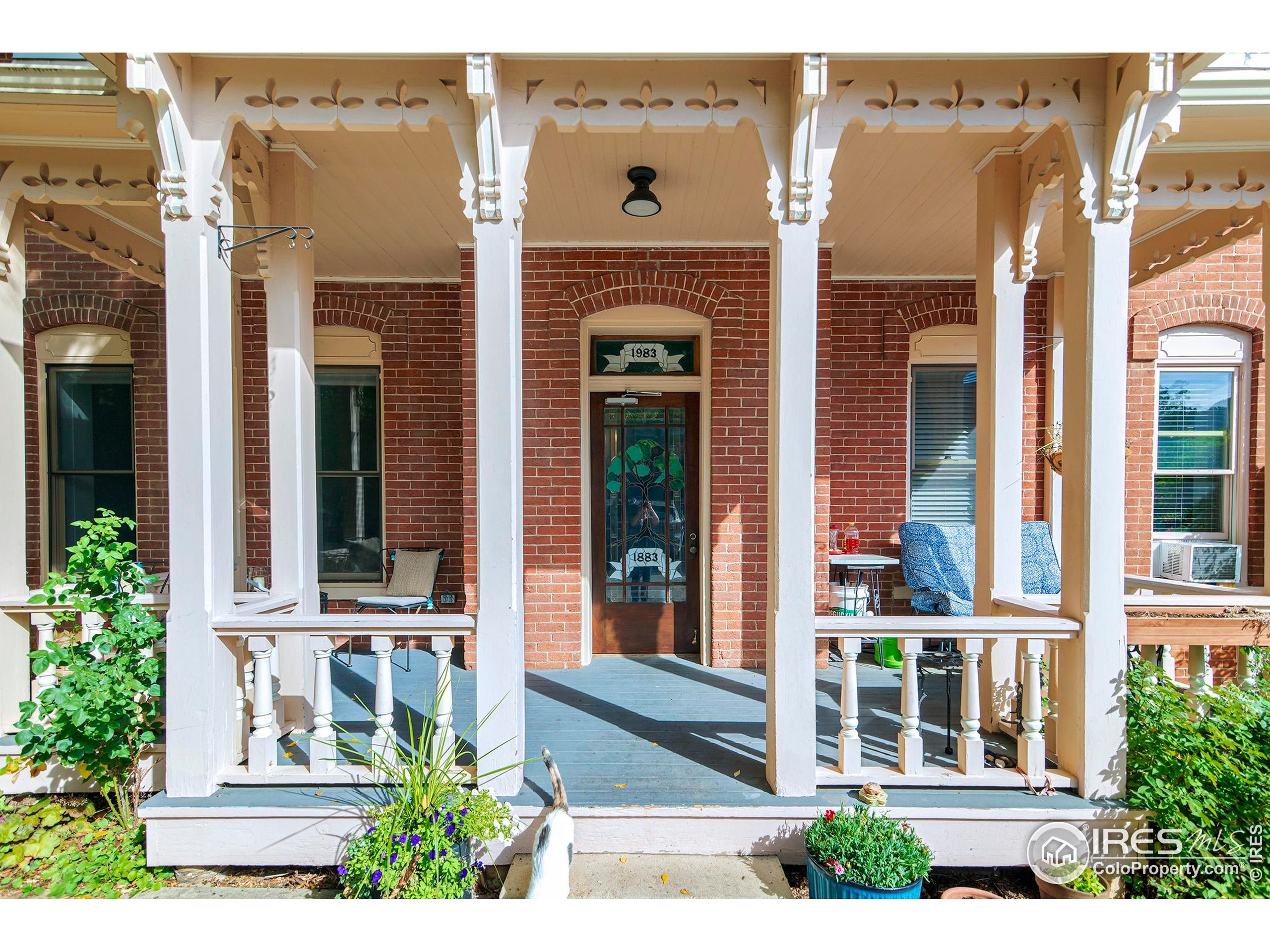 1237 Elder Avenue, Unit 1 Boulder, CO 80304 - Photo 1 of 15 front view of a brick house with a large window