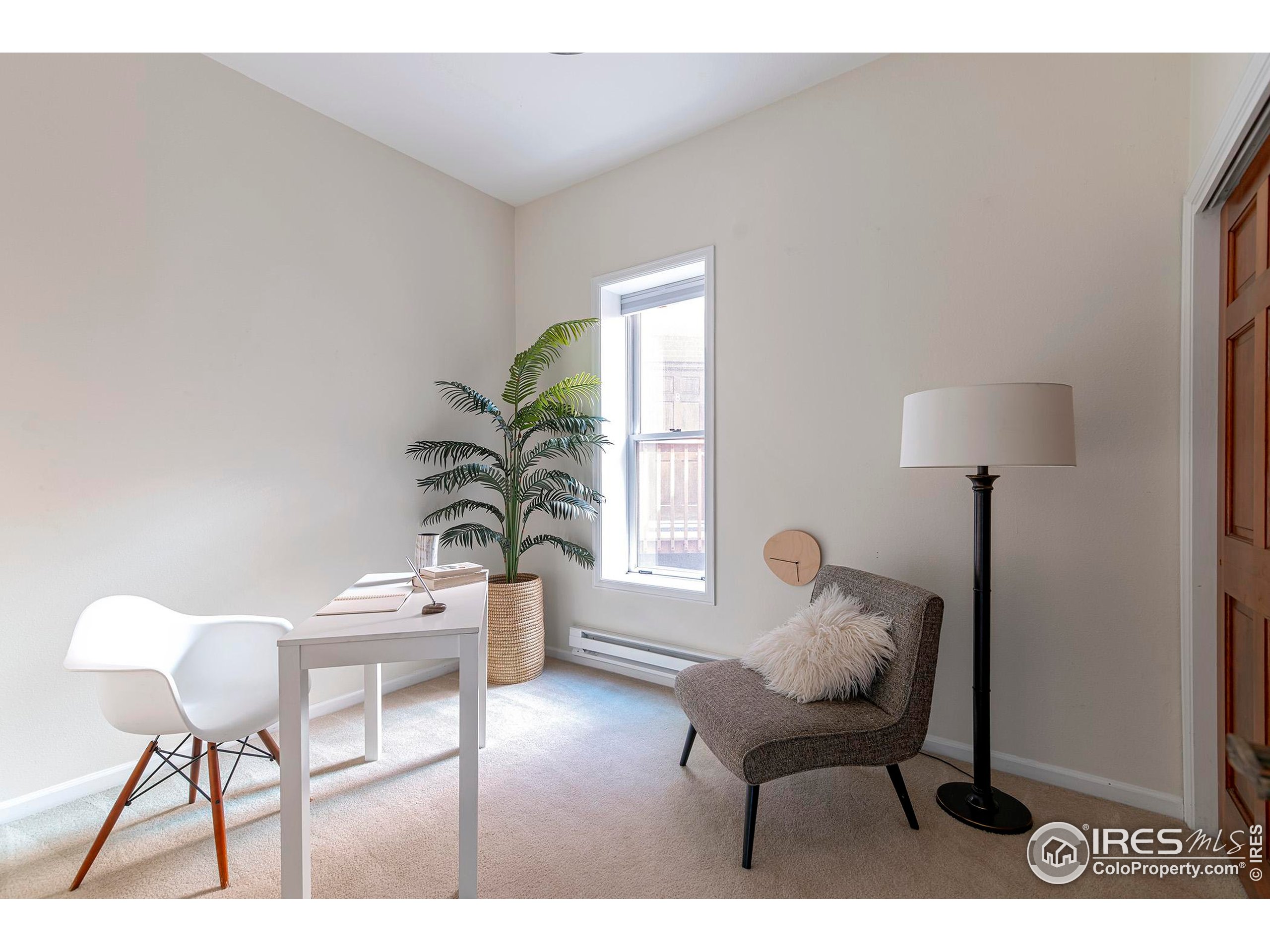 1237 Elder Avenue, Unit 1 Boulder, CO 80304 - Photo 11 of 15 a living room with furniture and a window