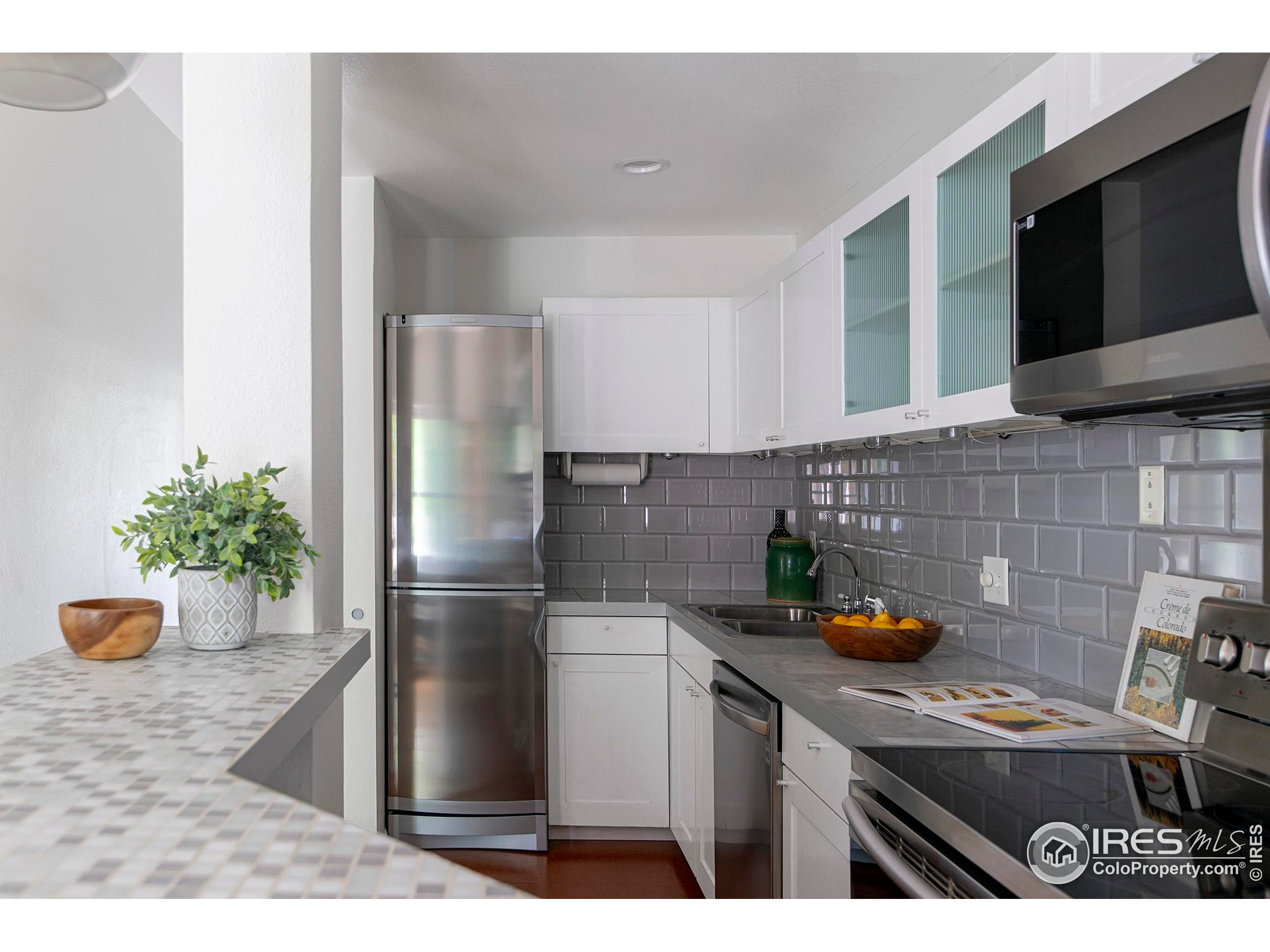 1237 Elder Avenue, Unit 1 Boulder, CO 80304 - Photo 4 of 15 a kitchen with stainless steel appliances granite countertop a refrigerator and a sink