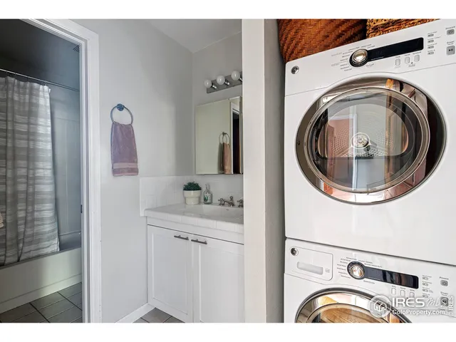 a view of bathroom with a sink and mirror